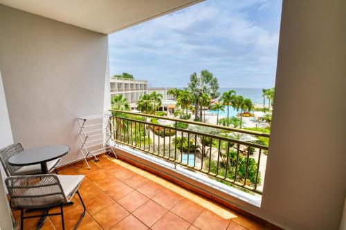 a balcony with a view of the ocean at Rincon of the Seas Grand Caribbean Hotel in Rincon