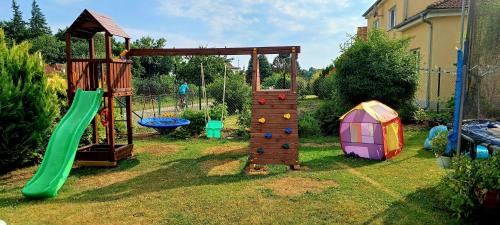 a playground with a slide and a play structure at Ubytování na Křížovce in Chlum u Třeboně