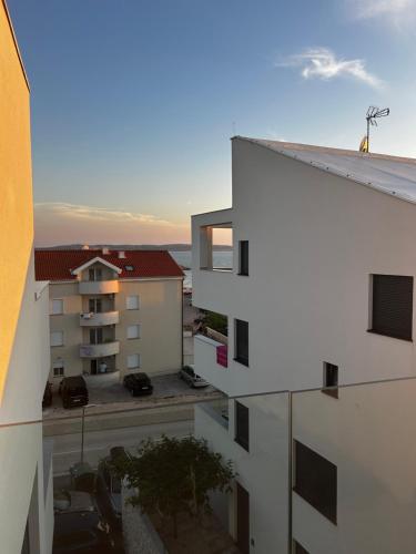 a view from the balcony of an apartment building at Apartment 98A7 in Povljana