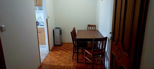 a kitchen with a table and chairs in a room at Ubytování na Křížovce in Chlum u Třeboně