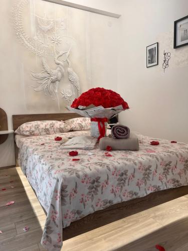 a bedroom with a bed with a bunch of roses at Angelina Art in Trnava