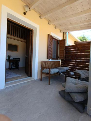 a living room with a couch and a table at Maniaveta's House in Exanthia