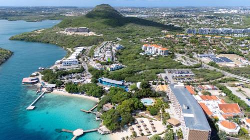 an aerial view of a resort on a island in a body of water at Piscadera Bay Resort 79 in Willemstad