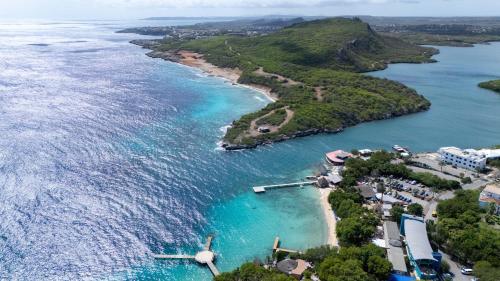 an aerial view of a small island in the ocean at Piscadera Bay Resort 79 in Willemstad