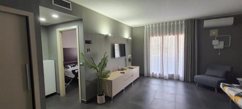 a room with a bathroom with a sink and a mirror at CRI'S & YOU guest room in Cosenza