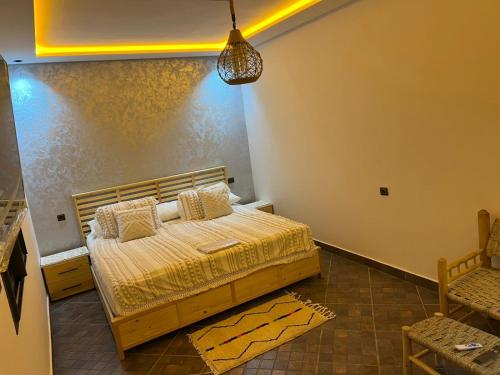 a bedroom with a bed in a room at Villa Ghailan in Asilah