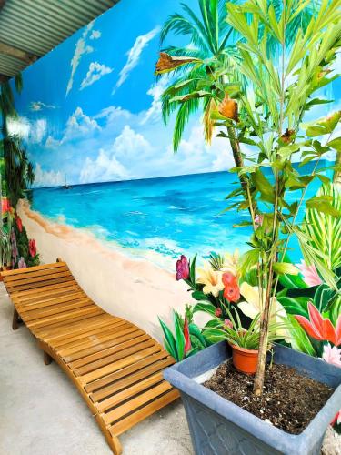 a mural of a beach with a bench at Unlock the Perfect Space for You in Pooc