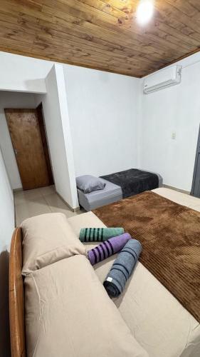 a room with a couch with pillows on the floor at Casa Amplia in Encarnación