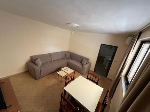 a living room with a couch and a table at Villa Bebi in Sarandë