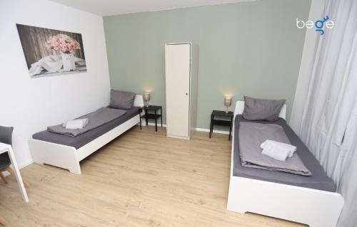 Ένα ή περισσότερα κρεβάτια σε δωμάτιο στο BEGE APARTMENTS ComfyStay