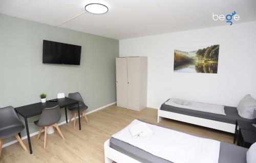 Μια τηλεόραση ή/και κέντρο ψυχαγωγίας στο BEGE APARTMENTS ComfyStay