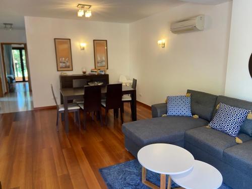 a living room with a couch and a table at Praia da Luz - Resort in Luz
