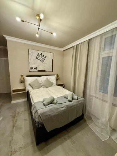 a bedroom with a large bed with a window at District One - Hideaway Hostel in Vienna
