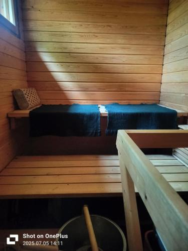 a room with two beds in a sauna at Retro House in Savonlinna