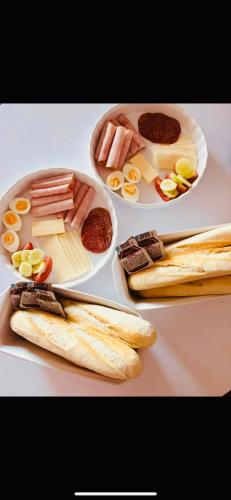 two plates of food with different types of food at Apartmány Alexander in Vrbov