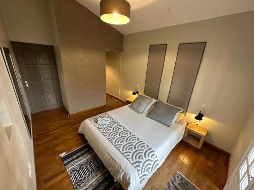 a bedroom with a bed with two pillows on it at Chambre Zoizo Paradis in Saint-André