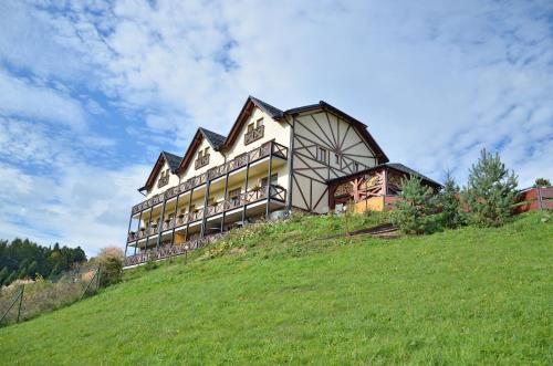 a large house on top of a hill at Penzion Na Vršku in Branná