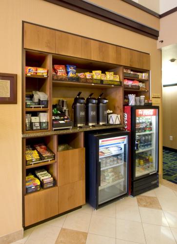 a store aisle with a refrigerator and food at Fairfield Inn Salt Lake City Draper in Draper