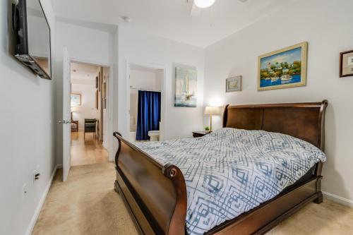 a bedroom with a bed with a blue and white comforter at Captiva sands 4308 in Rehoboth Beach