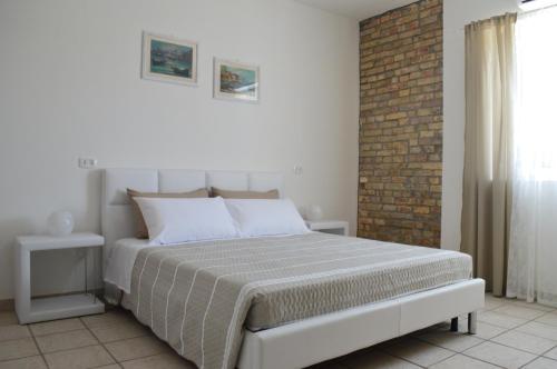 Postel nebo postele na pokoji v ubytování B&B A Casa di Lilla