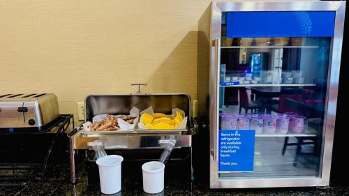 a food cart with food inside of a refrigerator at Comfort Inn & Suites Scarborough-Portland in Scarborough