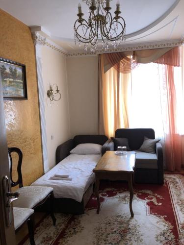 Postel nebo postele na pokoji v ubytování Петрос Family Hotel