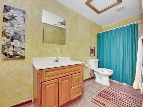a bathroom with a sink and a toilet at Eagles Roost - The Nest #11 at Wind Walker Homestead in Spring City