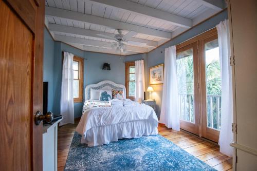 a bedroom with a bed with a blue wall at 385 Wahoo Drive in Fripp Island