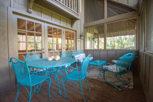 a blue table and chairs on a porch at 385 Wahoo Drive in Fripp Island