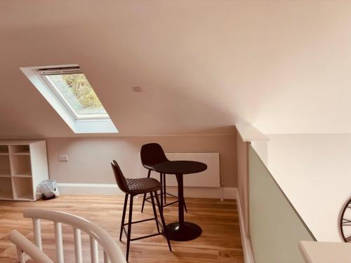 a room with a table and two chairs at Teach Máire, Downings in Downings
