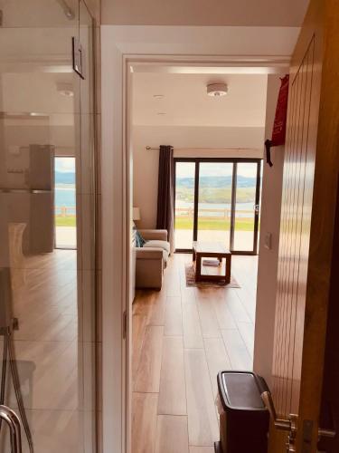 a hallway with a view of a living room at Teach Máire, Downings in Downings