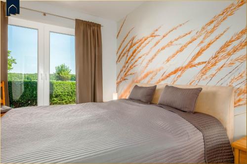 Ένα ή περισσότερα κρεβάτια σε δωμάτιο στο Ferienwohnung Krebssee Idyll 1