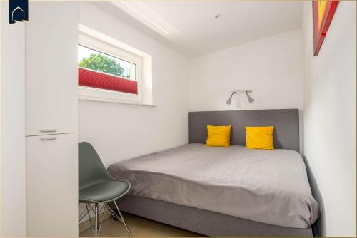 Ένα ή περισσότερα κρεβάτια σε δωμάτιο στο Ferienwohnung Krebssee Idyll 2