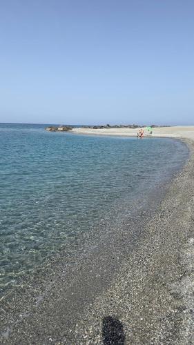 a shadow of a person on the beach at La casa dei tre platani in Case Torre di Sacco