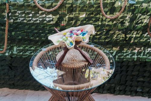 a glass table with a bowl on top of it at Cozy Escape Kavala in Kavala