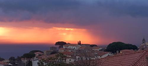 a view of a city at sunset at Detached house in San Piero in Campo, Elba Island in San Piero in Campo