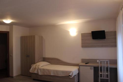 Postel nebo postele na pokoji v ubytování Hotel Miralago