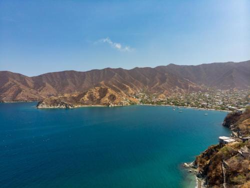 an aerial view of a lake with mountains in the background at Mercure Santa Marta Emile in Santa Marta