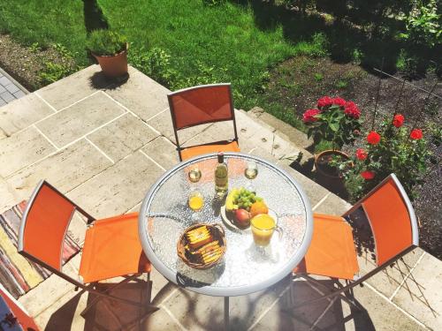 a glass table with fruit on it on a patio at Book-A-Room Salzburg Apartment 5-6-7-8 in Salzburg