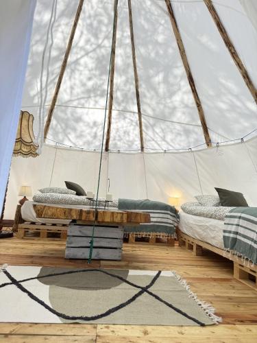 a room with two beds in a tent at Pokoje Gościnne Przylesie in Łobez