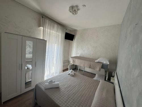 Postel nebo postele na pokoji v ubytování Hotel Eriale Nuova Gestione
