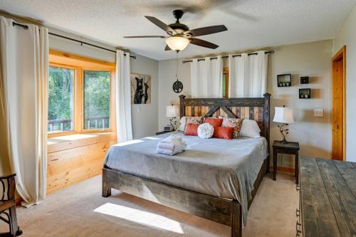 a bedroom with a bed and a ceiling fan at Yellow Mountain Vista Echoes at 4400 in Cullowhee