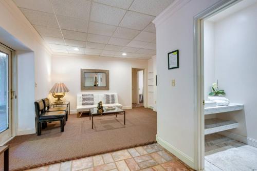 a living room with a couch and a table at Cozy Cockeysville Retreat with Furnished Deck in Cockeysville