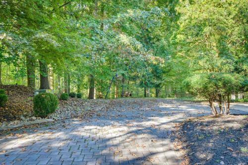 a brick road with trees and leaves on it at Cozy Cockeysville Retreat with Furnished Deck in Cockeysville