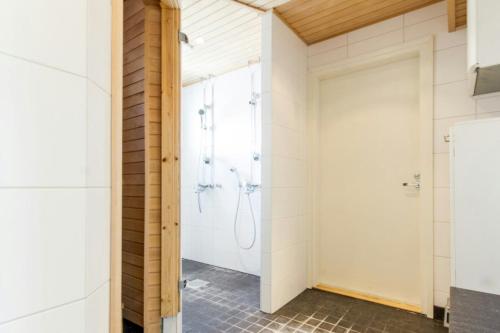 a bathroom with a shower and a shower stall at Spacious Apartment for 8 with Sauna in Kerava