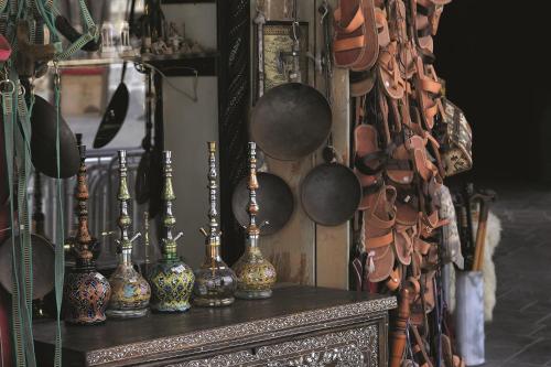 a group of vases sitting on top of a table at Mövenpick Hotel Doha in Doha