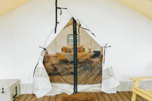 a view of a room with a tent at The Meadowlark's Nest - Glamping Tent with AC in Rogers