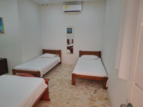 a room with two beds in a room at Finca Villa Gabriela 