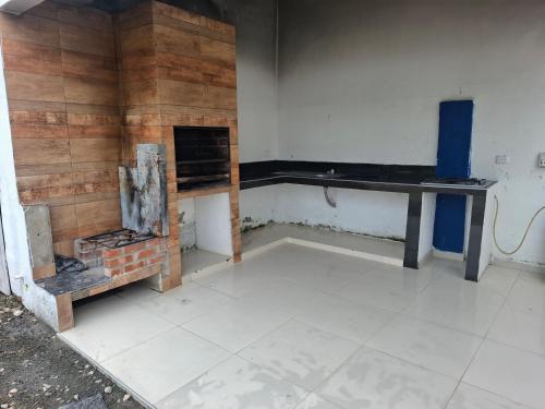 a room with a fireplace and a table in it at Finca Villa Gabriela 