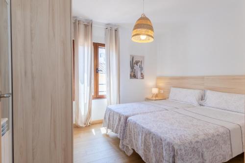 Ένα ή περισσότερα κρεβάτια σε δωμάτιο στο BaruHaus Murias